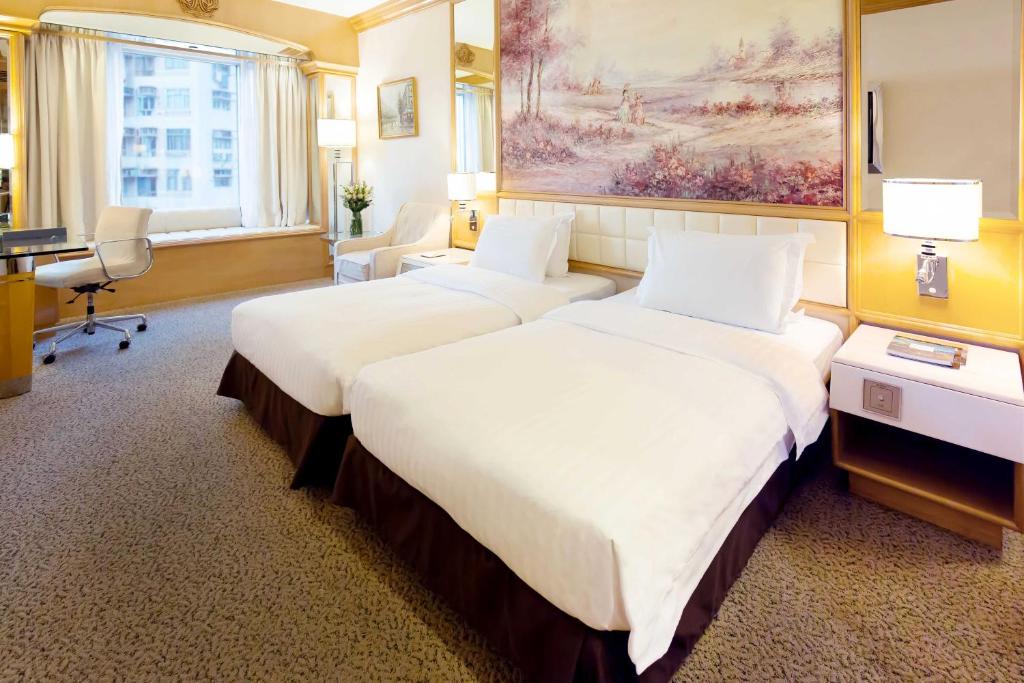 Voodi või voodid majutusasutuse Regal Hongkong Hotel toas