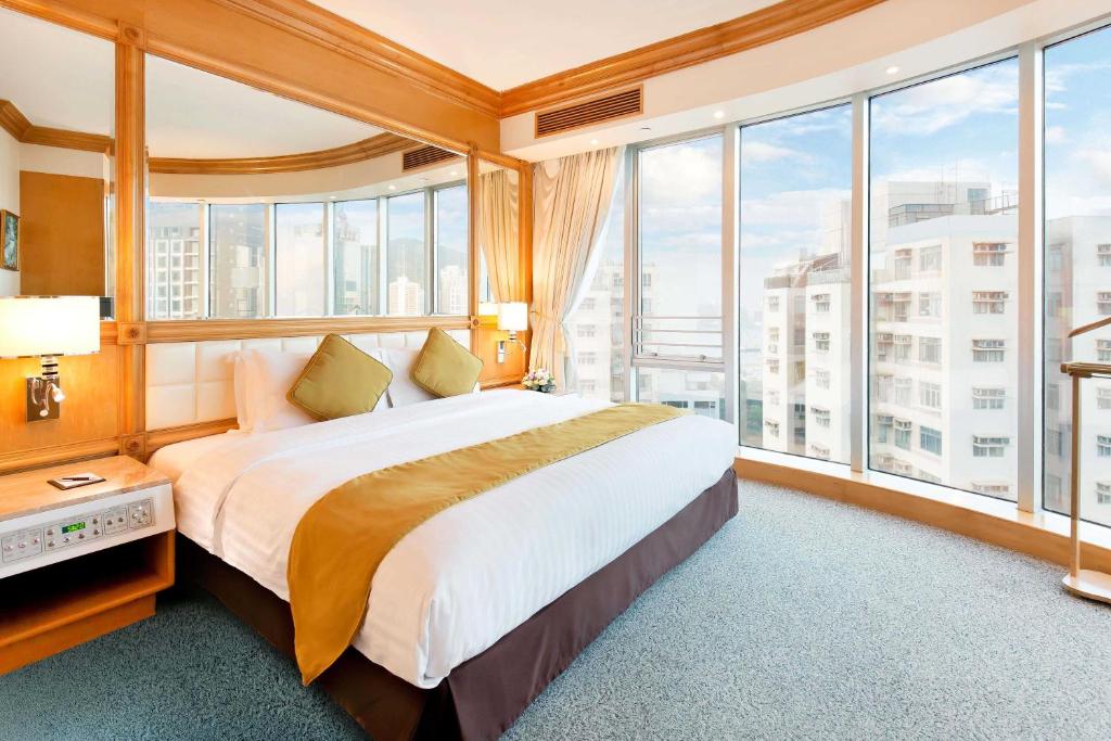Voodi või voodid majutusasutuse Regal Hongkong Hotel toas