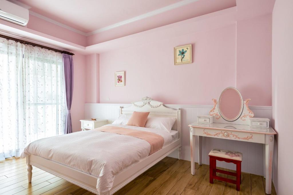 Postel nebo postele na pokoji v ubytování Iris Guest House