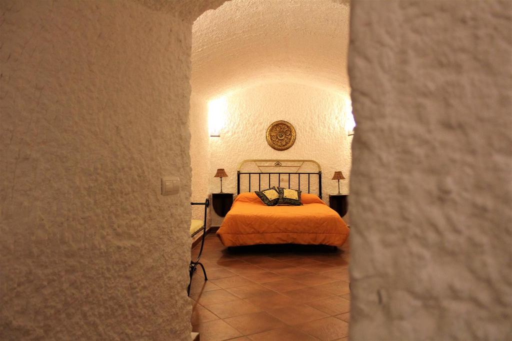 Posteľ alebo postele v izbe v ubytovaní Cuevas La Cocinillas