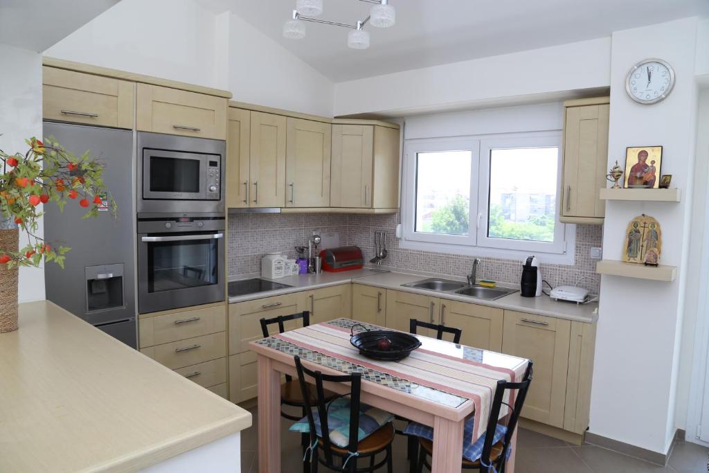 A kitchen or kitchenette at Konstantinos Luxury Apartment