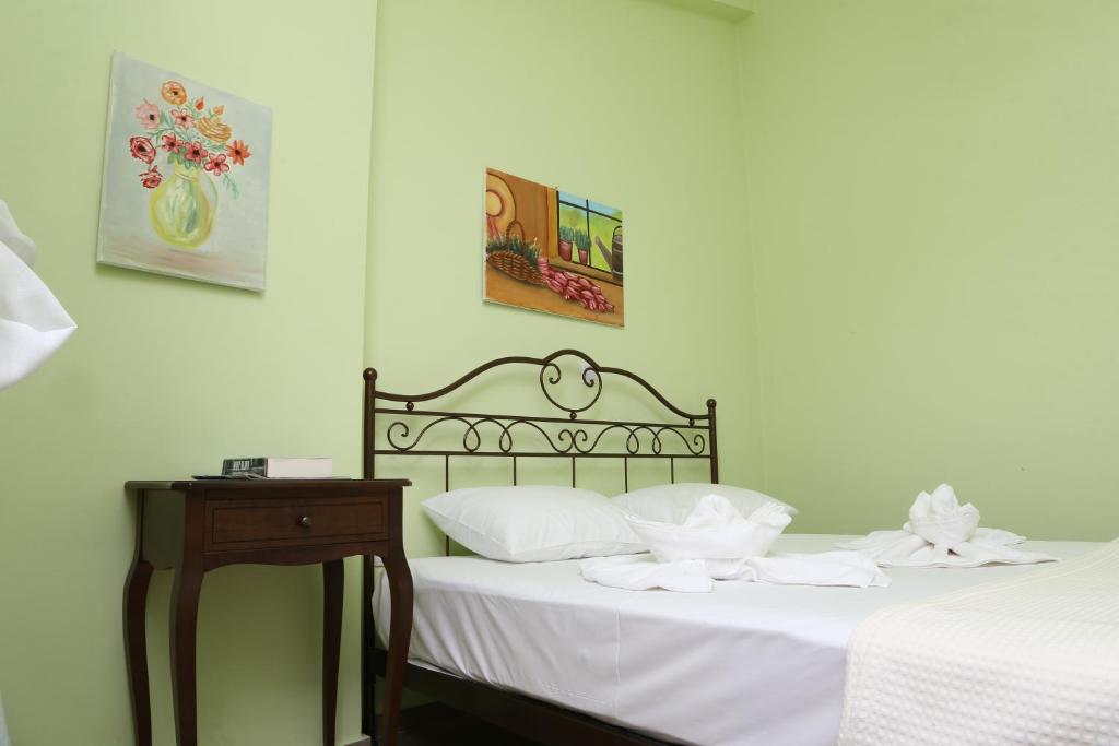A bed or beds in a room at Konstantinos Luxury Apartment