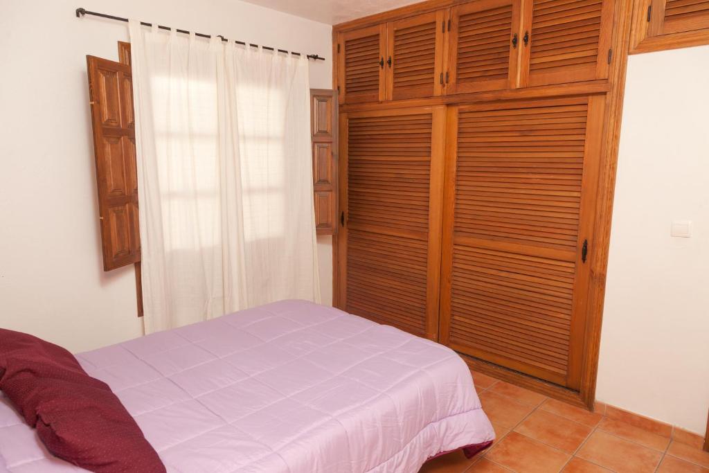 A bed or beds in a room at Casa Larga