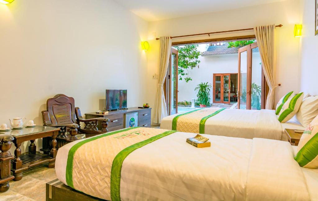 Postel nebo postele na pokoji v ubytování Fig Tree Boutique Villa