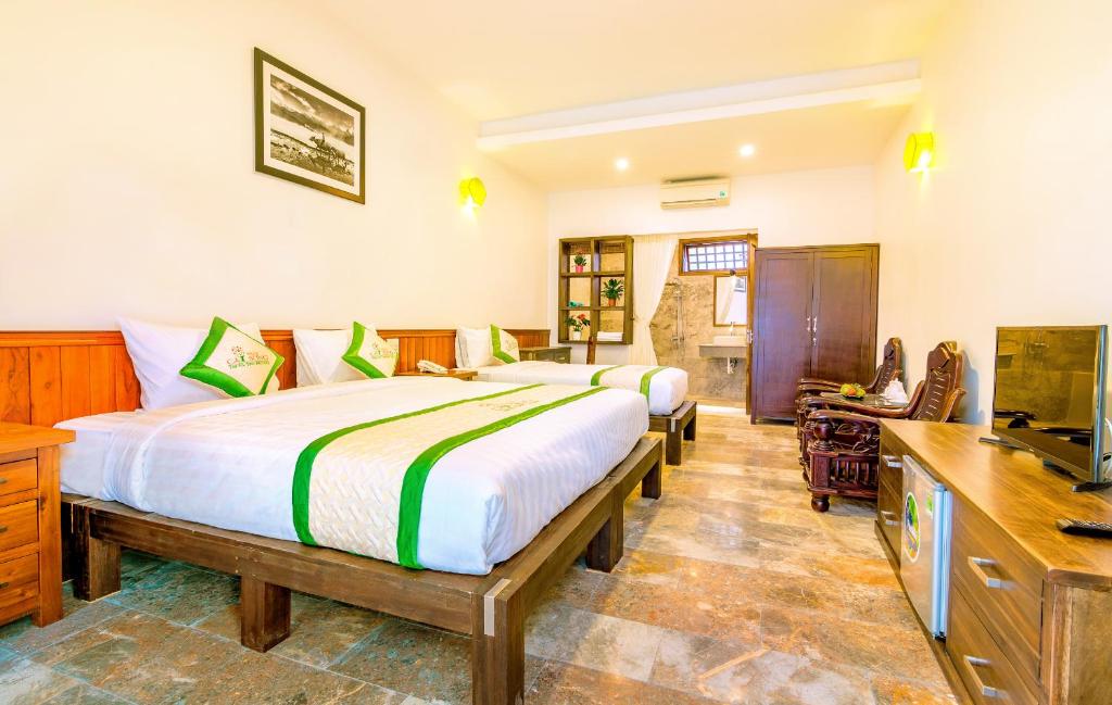 Postel nebo postele na pokoji v ubytování Fig Tree Boutique Villa