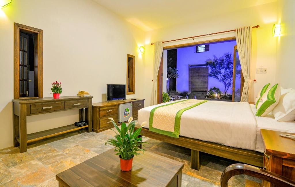 TV a/nebo společenská místnost v ubytování Fig Tree Boutique Villa