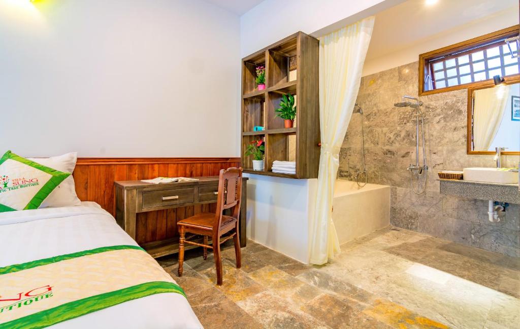 Postel nebo postele na pokoji v ubytování Fig Tree Boutique Villa