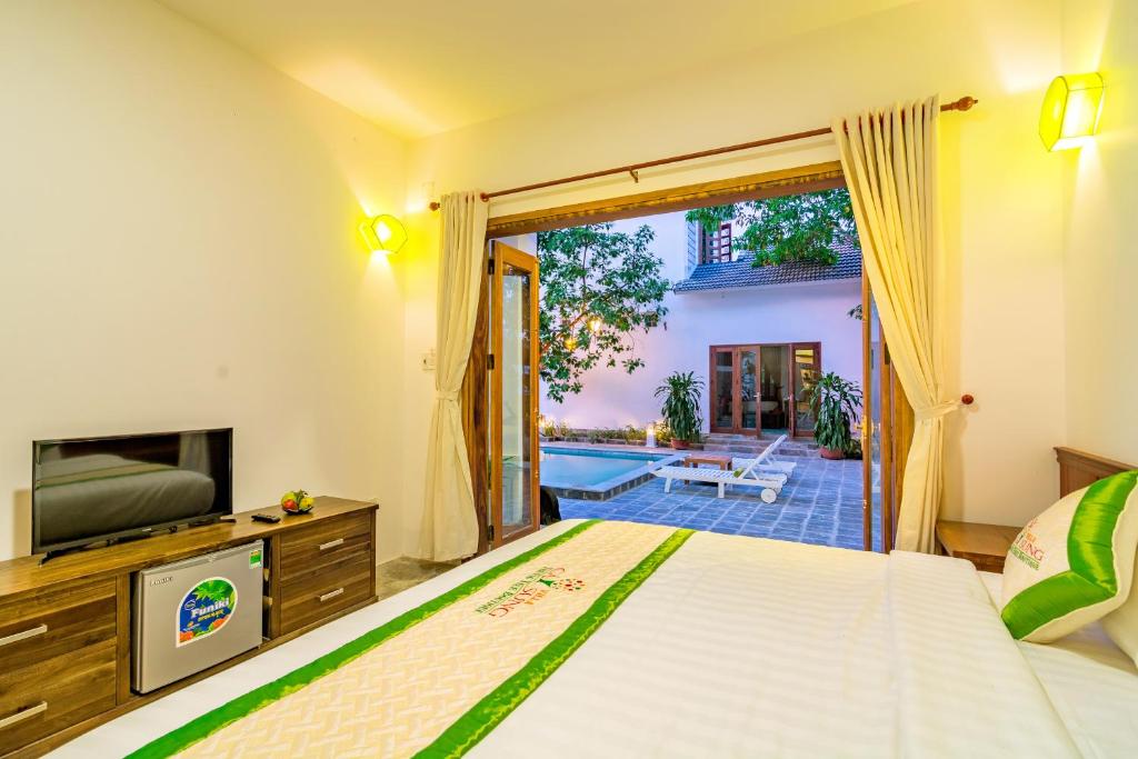 Postel nebo postele na pokoji v ubytování Fig Tree Boutique Villa