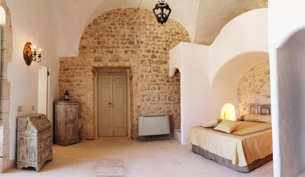 Postel nebo postele na pokoji v ubytování Palazzo Camarda B&B