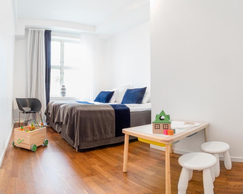 Postel nebo postele na pokoji v ubytování Fredriksten Hotell