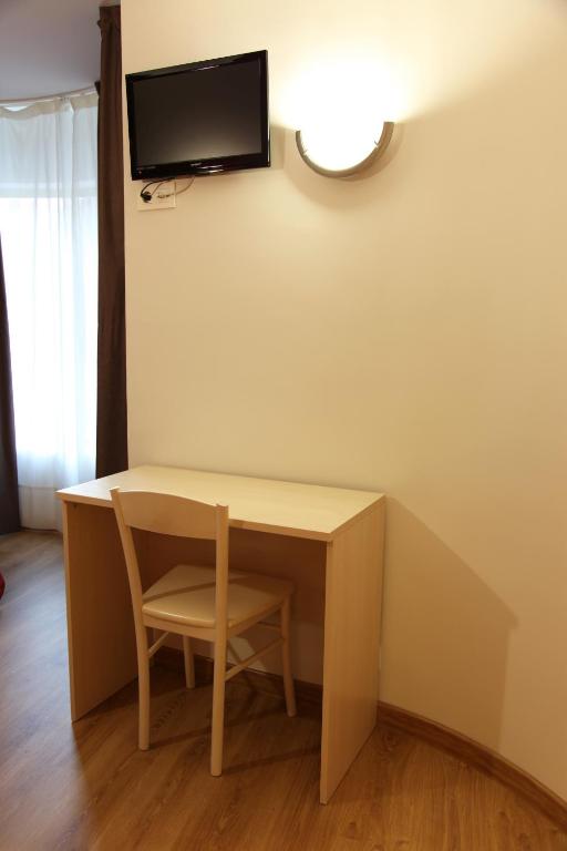 Televízia a/alebo spoločenská miestnosť v ubytovaní Hostal Santel San Marcos