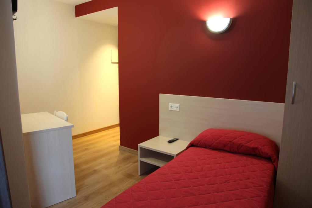 Posteľ alebo postele v izbe v ubytovaní Hostal Santel San Marcos
