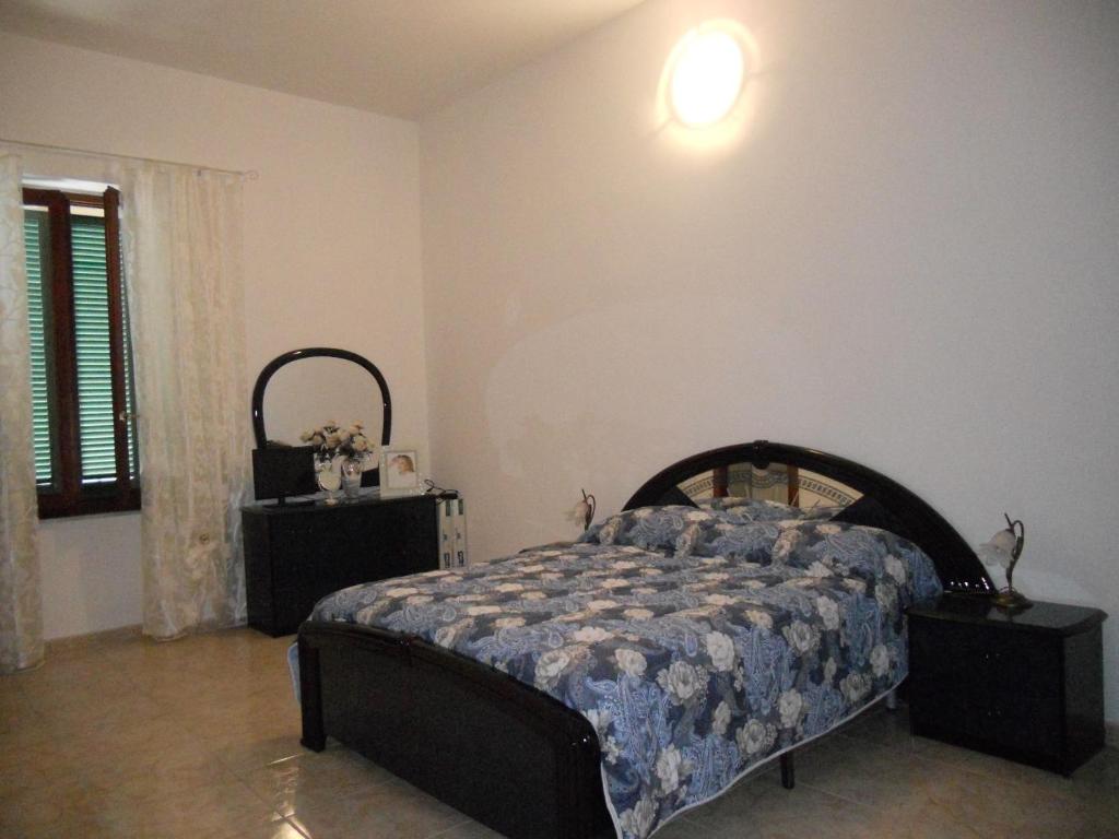 Postel nebo postele na pokoji v ubytování Guest House Efisio