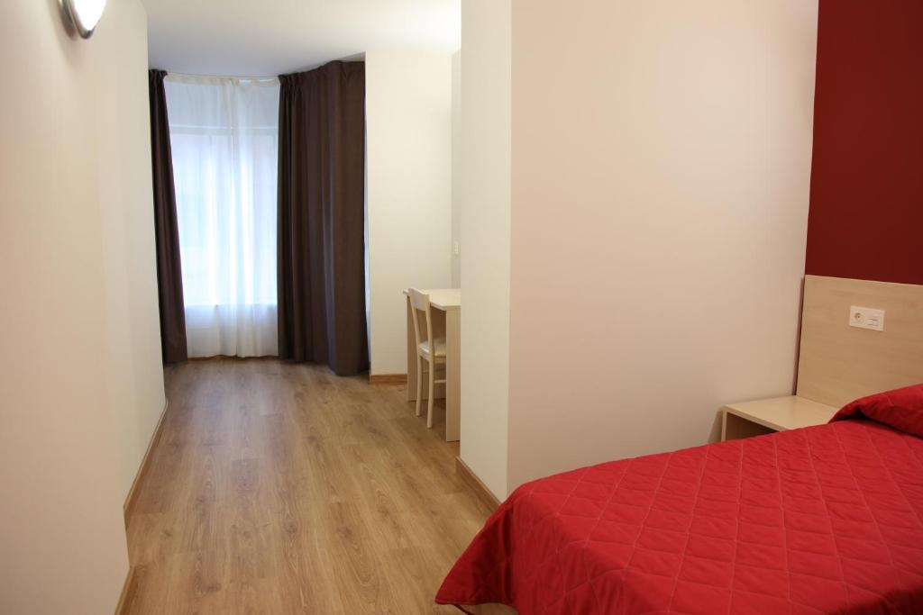 Posteľ alebo postele v izbe v ubytovaní Hostal Santel San Marcos