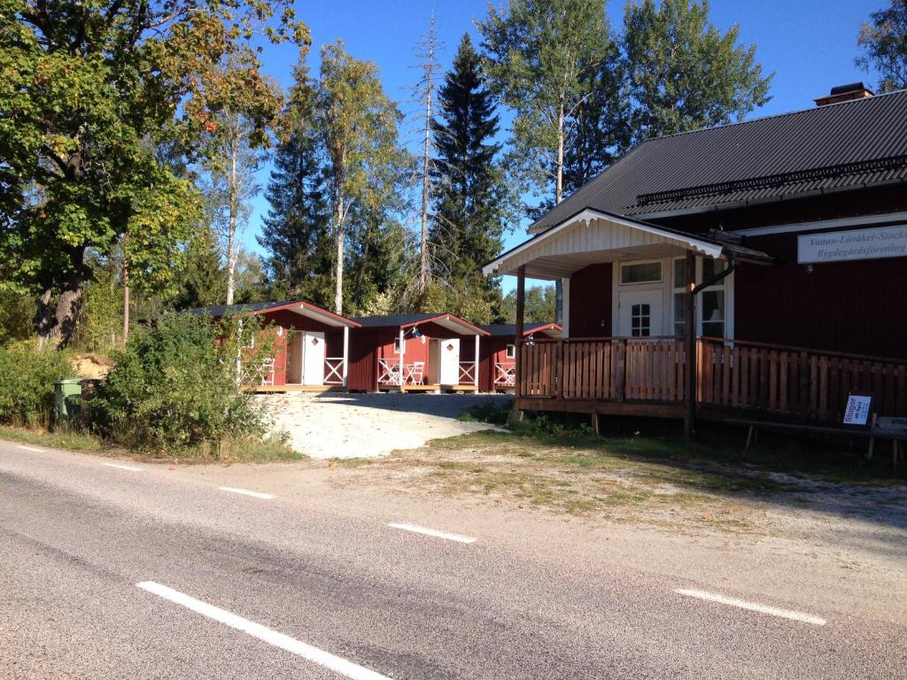 a row of cottages on the side of a road at VLS Stugby in Åshammar