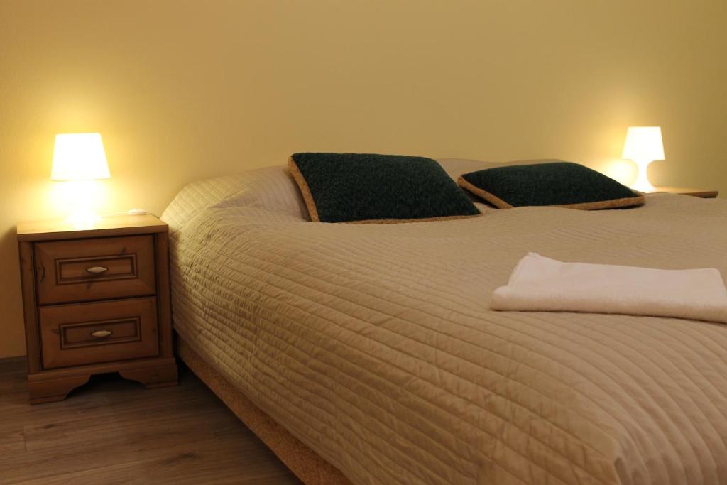 Posteľ alebo postele v izbe v ubytovaní Apartament Raz Dwa Trzy