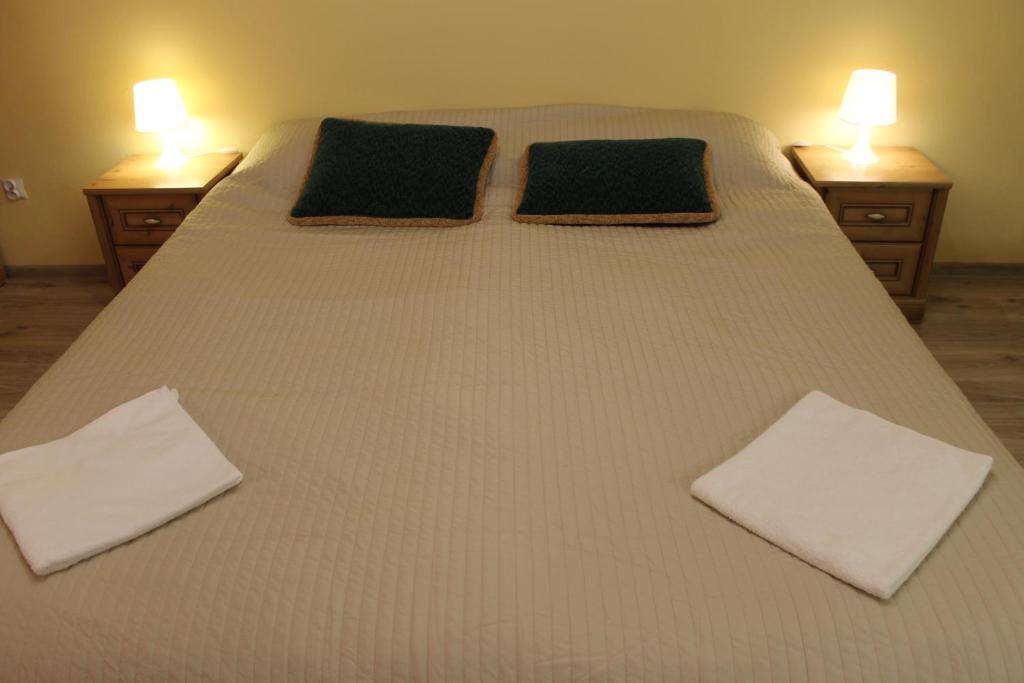 Posteľ alebo postele v izbe v ubytovaní Apartament Raz Dwa Trzy