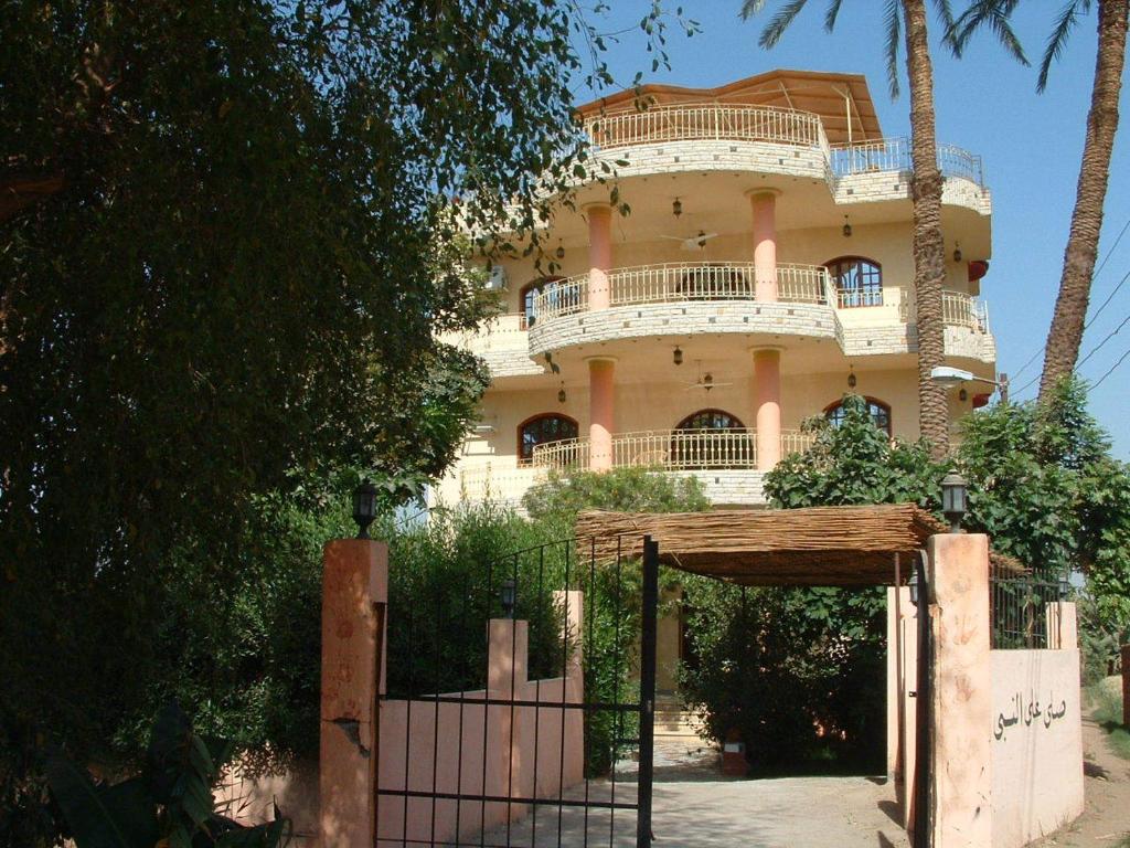 a building with a gate in front of it at Home Sweet Home Luxor Apartments in Luxor