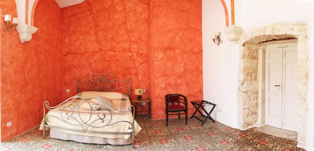 Postel nebo postele na pokoji v ubytování Palazzo Camarda B&B