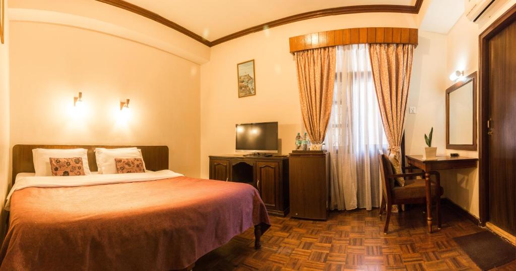 Postel nebo postele na pokoji v ubytování Hotel Excelsior