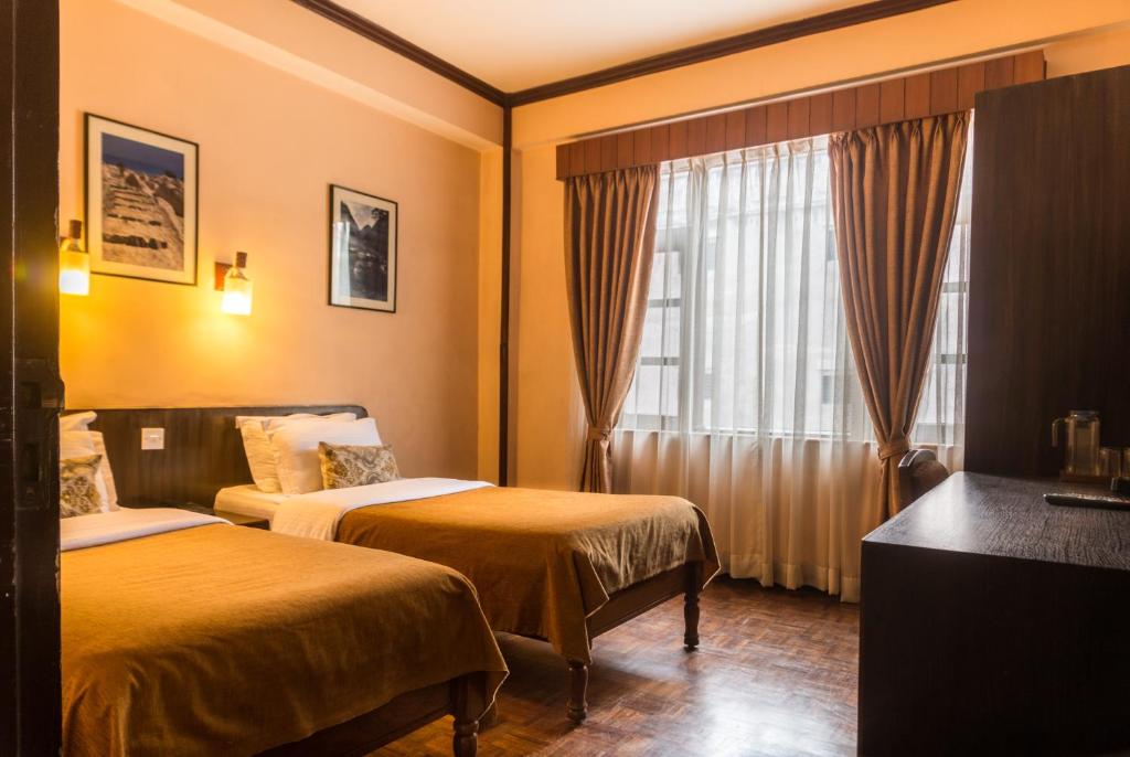 Postel nebo postele na pokoji v ubytování Hotel Excelsior