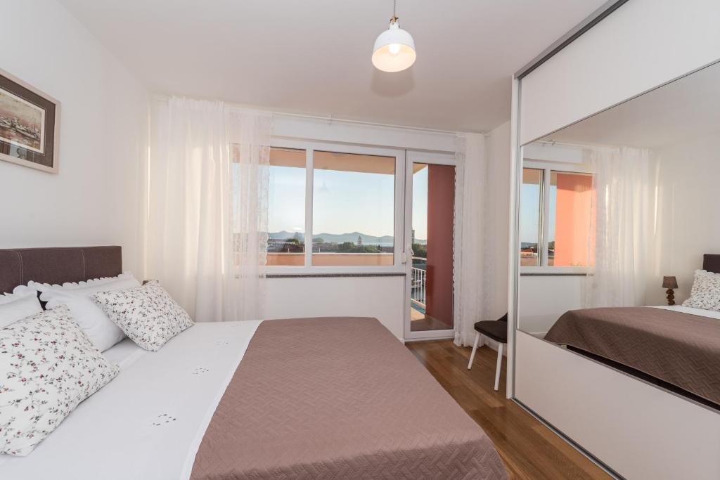 Posteľ alebo postele v izbe v ubytovaní Amazing View Apartment