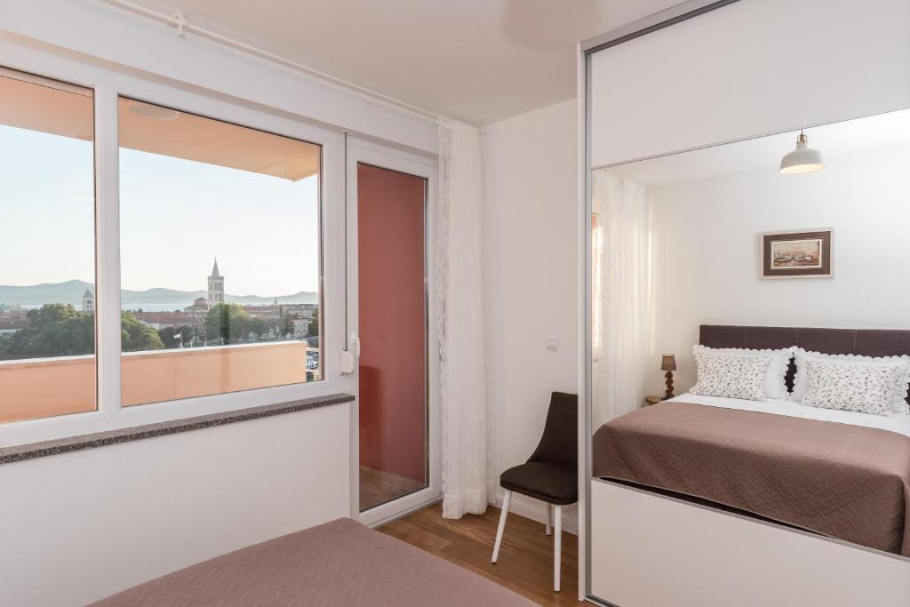 Posteľ alebo postele v izbe v ubytovaní Amazing View Apartment