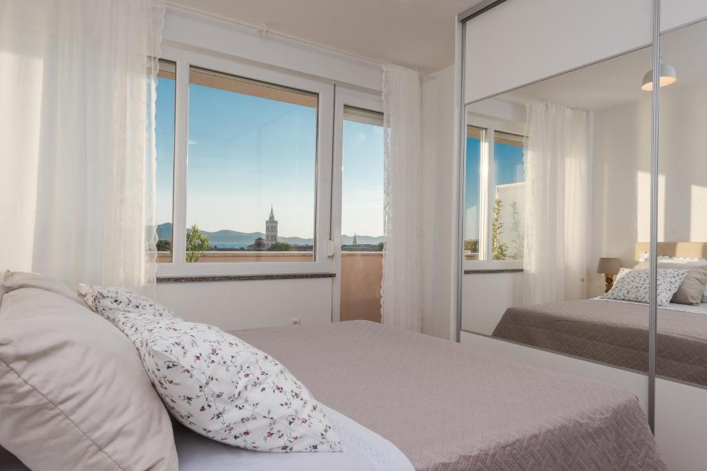 Posteľ alebo postele v izbe v ubytovaní Amazing View Apartment