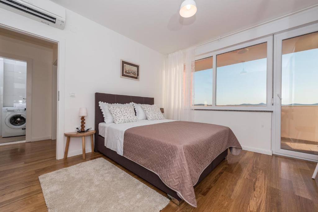 Posteľ alebo postele v izbe v ubytovaní Amazing View Apartment