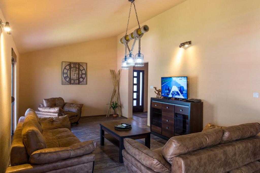 Televizorius ir (arba) pramogų centras apgyvendinimo įstaigoje Apartment Bambo Tre Sorrele