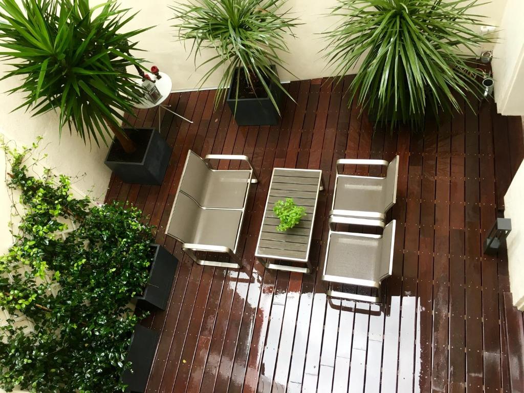 an overhead view of a patio with chairs and plants at Appartements Urban et Pure in Cannes