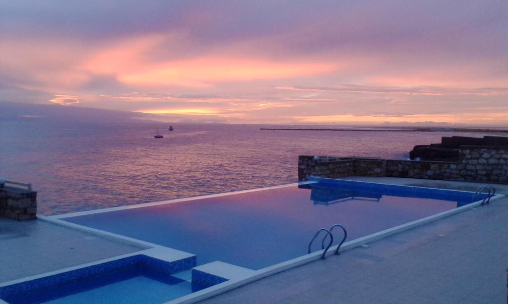 a swimming pool with a view of the ocean at Maio Vacanze in Vila do Porto