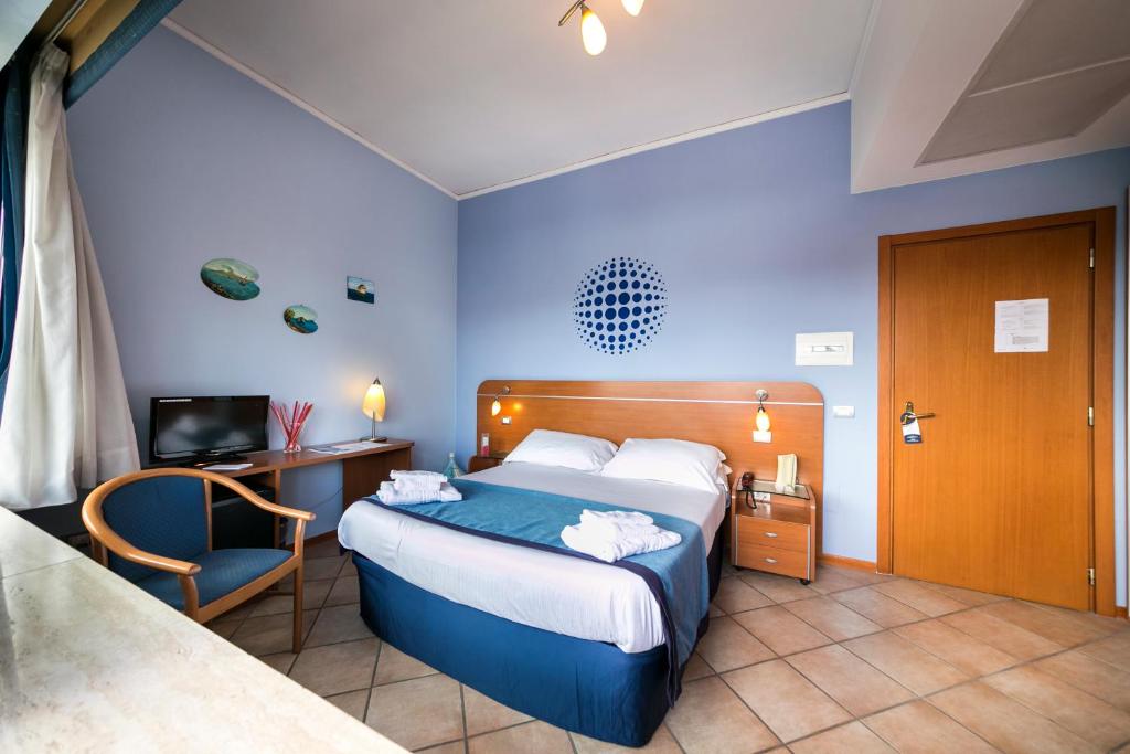 Postel nebo postele na pokoji v ubytování Millennium Gold Hotel