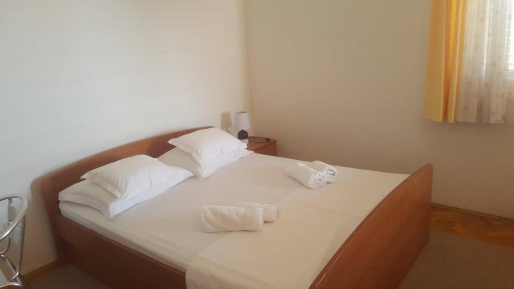 Postel nebo postele na pokoji v ubytování Apartments Villa Anna