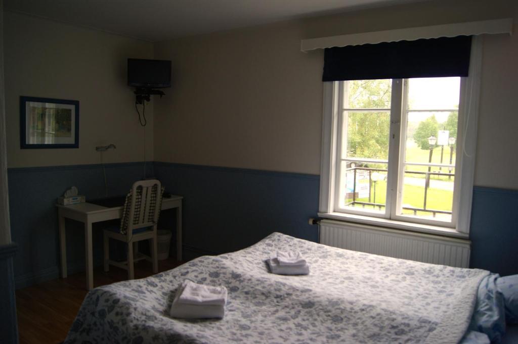 Postel nebo postele na pokoji v ubytování Lugnet Malung Hotell