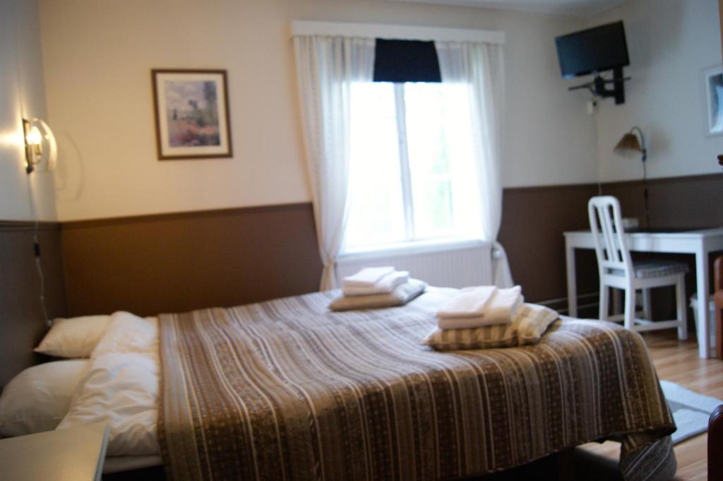 Postel nebo postele na pokoji v ubytování Lugnet Malung Hotell