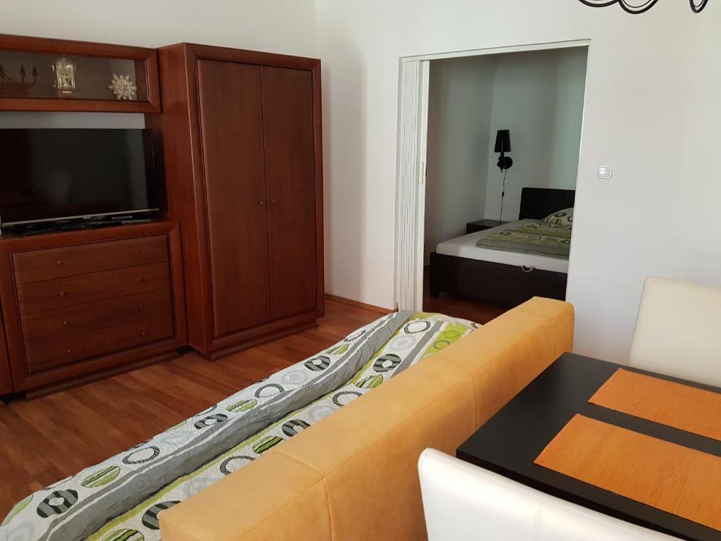 Posteľ alebo postele v izbe v ubytovaní Apartman Kaszás Central