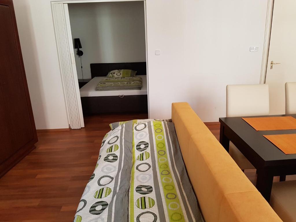 Posteľ alebo postele v izbe v ubytovaní Apartman Kaszás Central