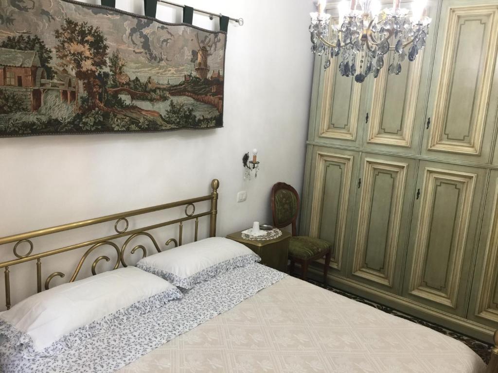 Postel nebo postele na pokoji v ubytování locazione turistica Sole