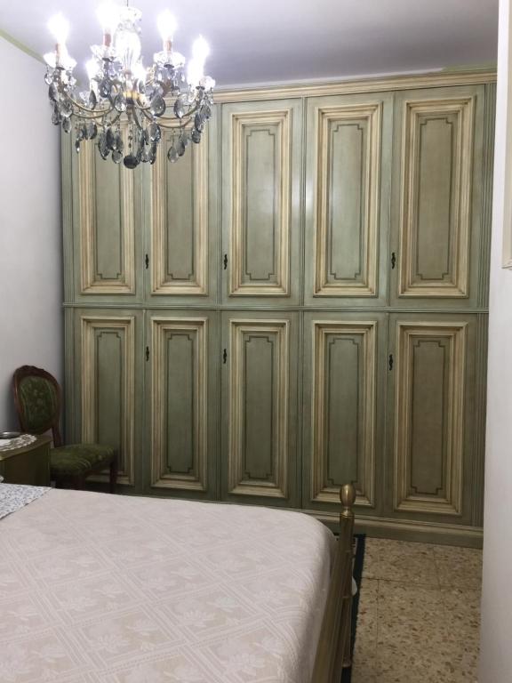 Postel nebo postele na pokoji v ubytování locazione turistica Sole