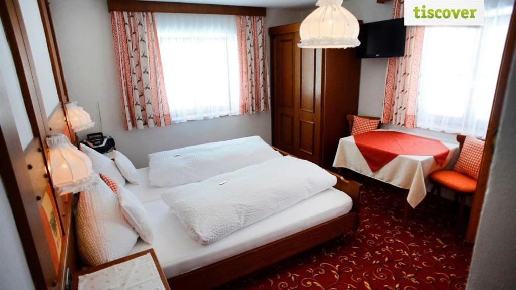 Postel nebo postele na pokoji v ubytování Gastehaus Wolf