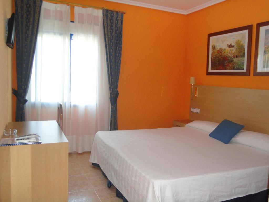 Postel nebo postele na pokoji v ubytování Hotel Mirador