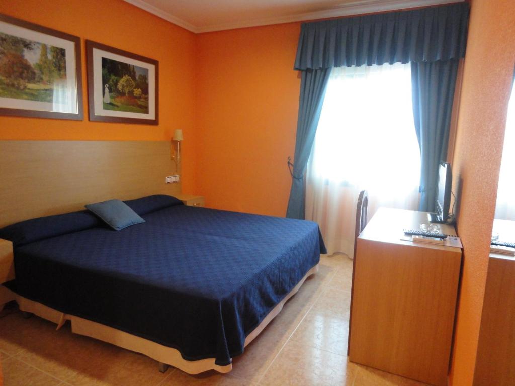 Postel nebo postele na pokoji v ubytování Hotel Mirador