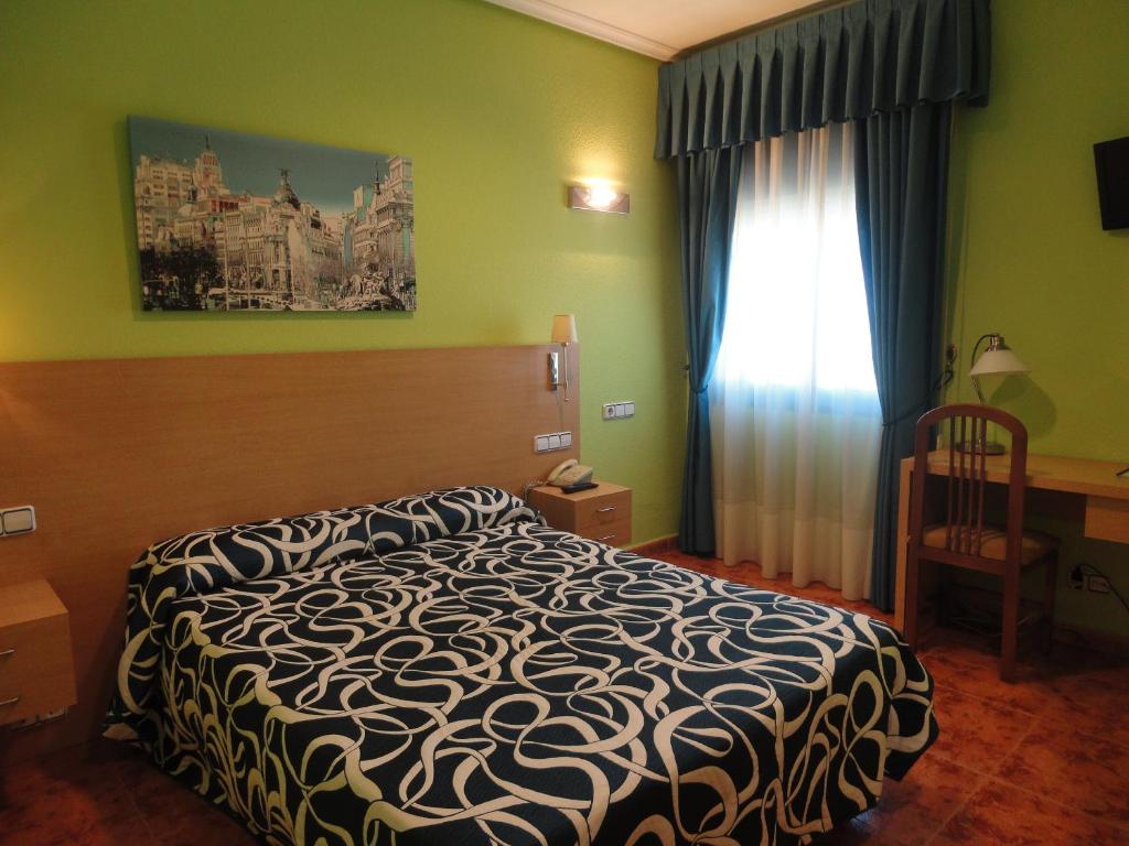 Postel nebo postele na pokoji v ubytování Hotel Mirador