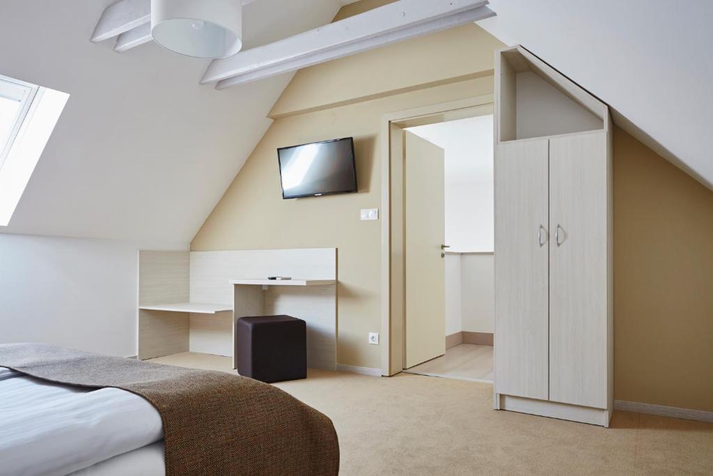 TV a/nebo společenská místnost v ubytování Hotel Astoria