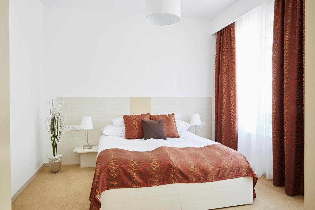 Postel nebo postele na pokoji v ubytování Hotel Astoria