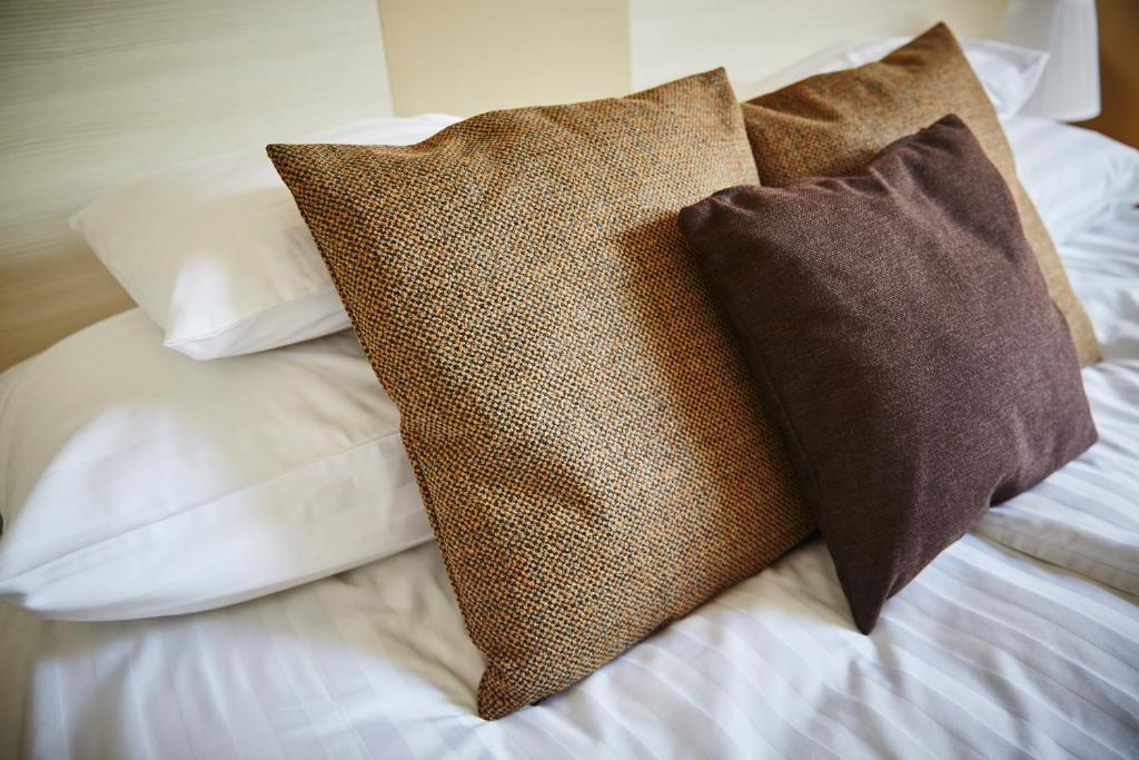 Postel nebo postele na pokoji v ubytování Hotel Astoria