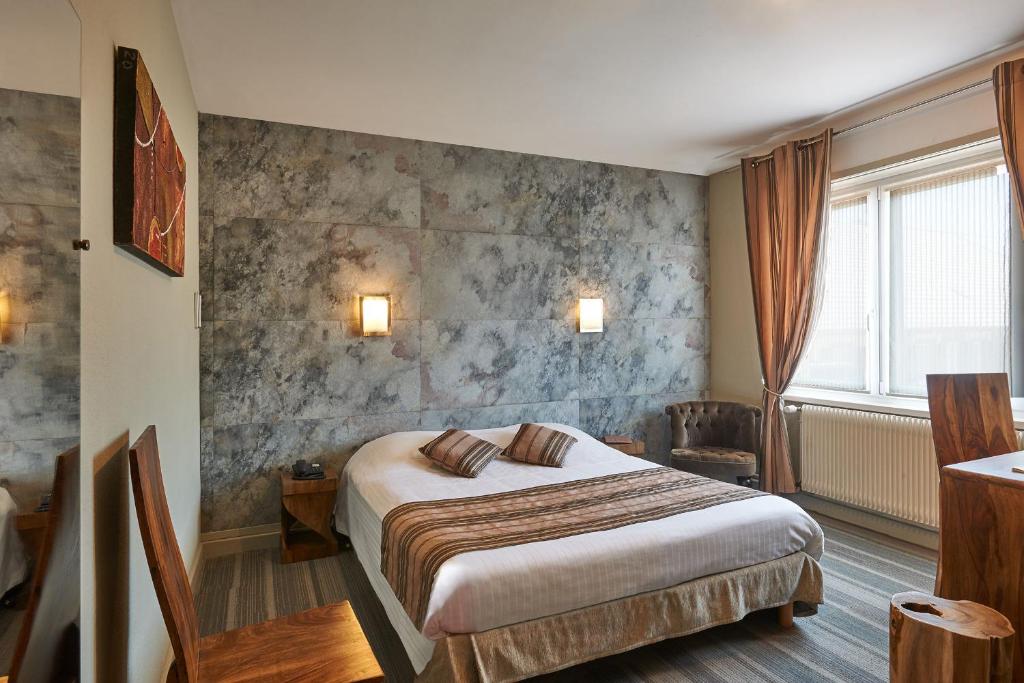 Postel nebo postele na pokoji v ubytování Parc Hôtel