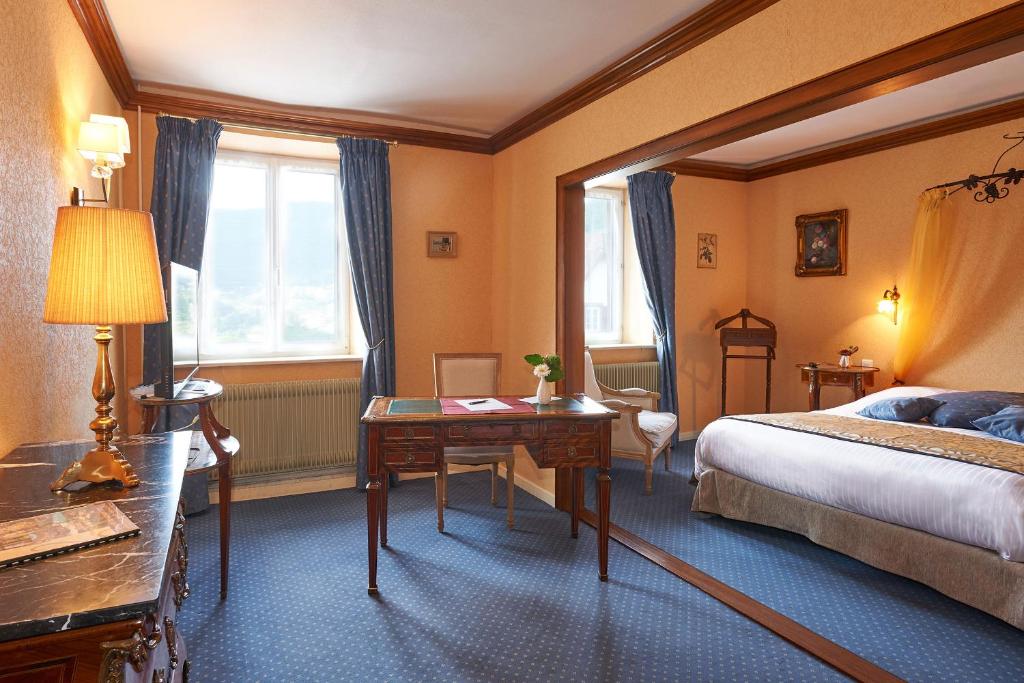 Postel nebo postele na pokoji v ubytování Parc Hôtel