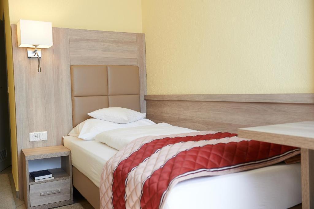 Postel nebo postele na pokoji v ubytování Hotel Wendelstein
